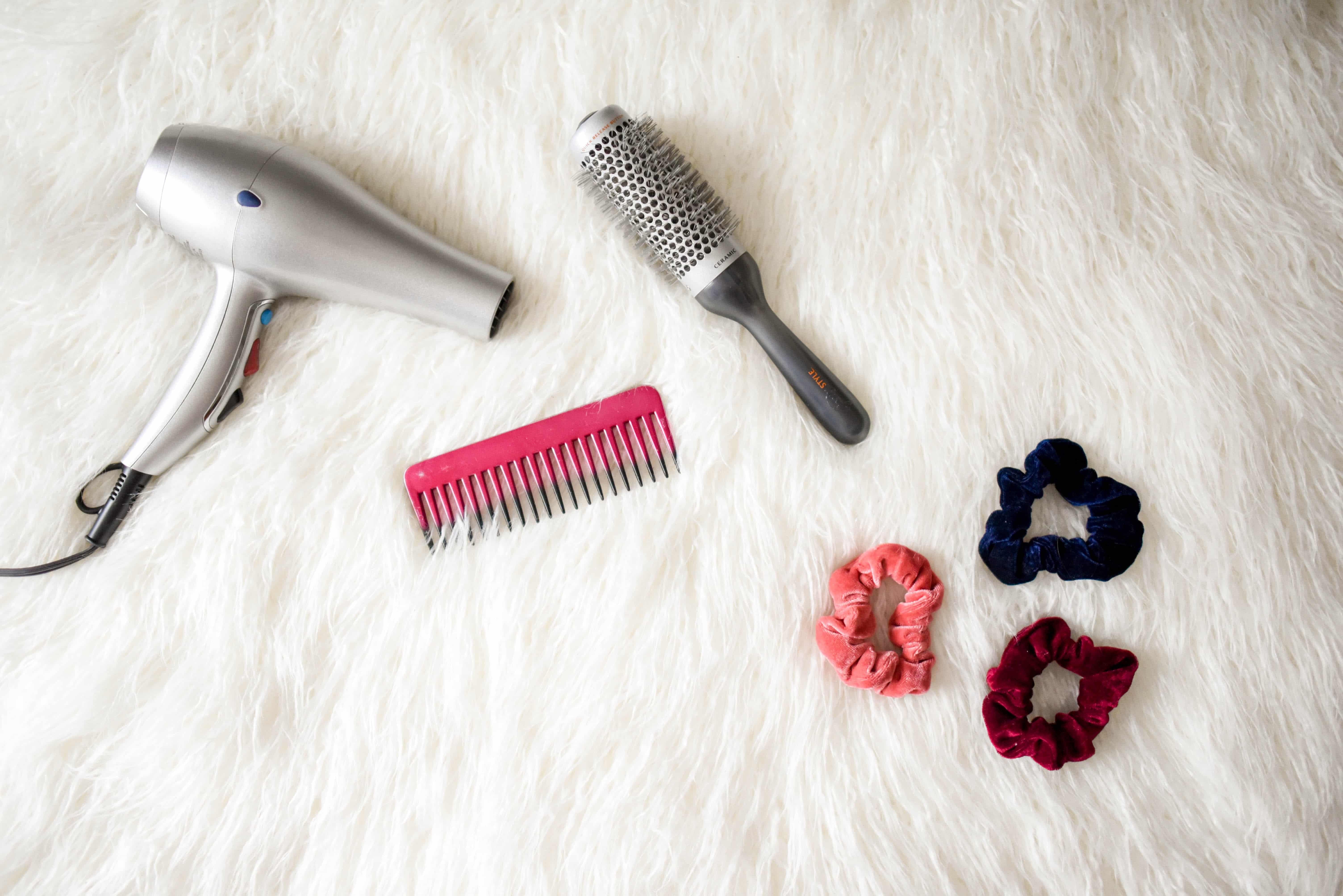 hair dryer, brush, comb and hair ties 
