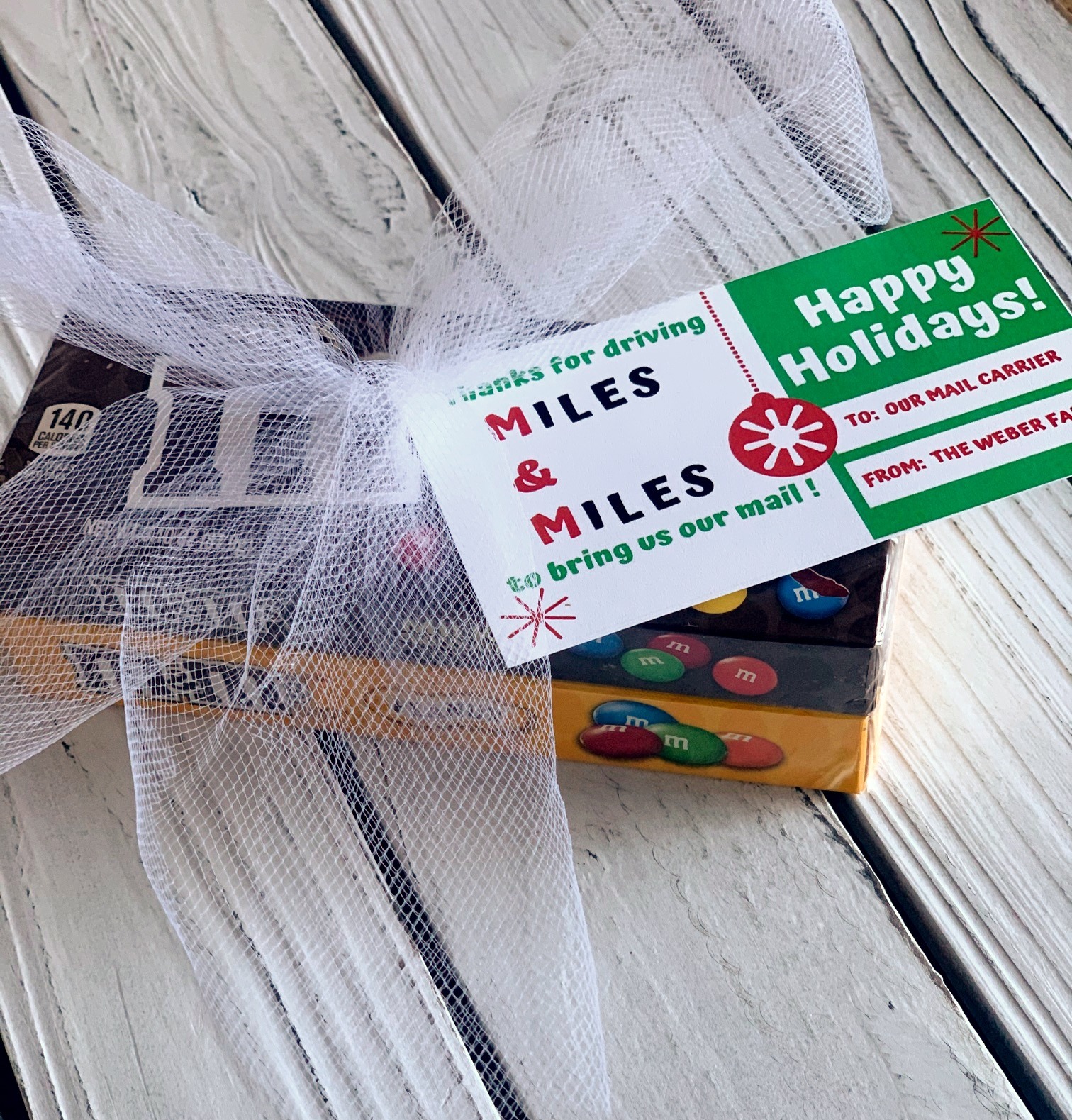 M&M candy gift with tag for mail carrier