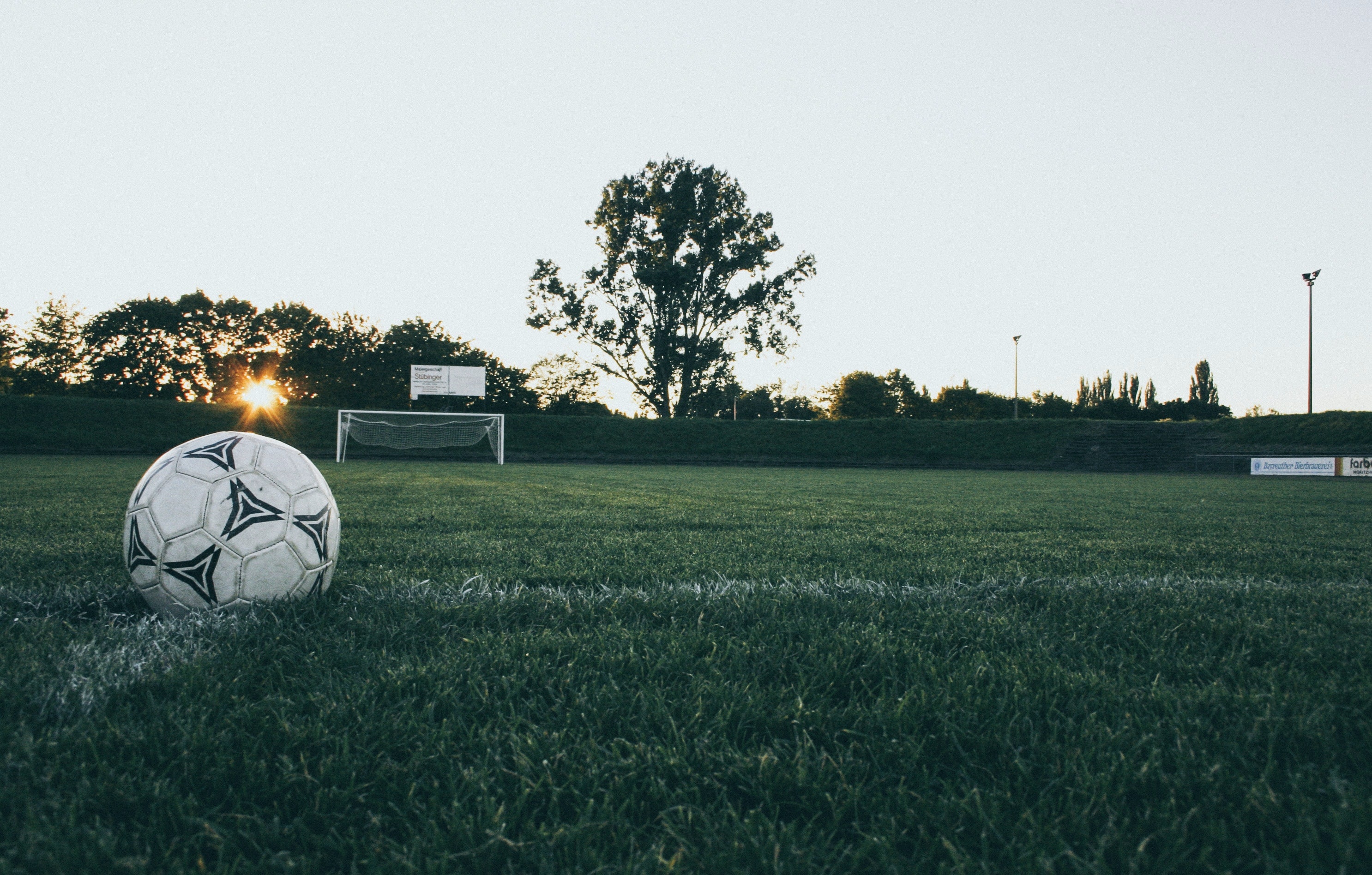 Soccer ball on a field with goal