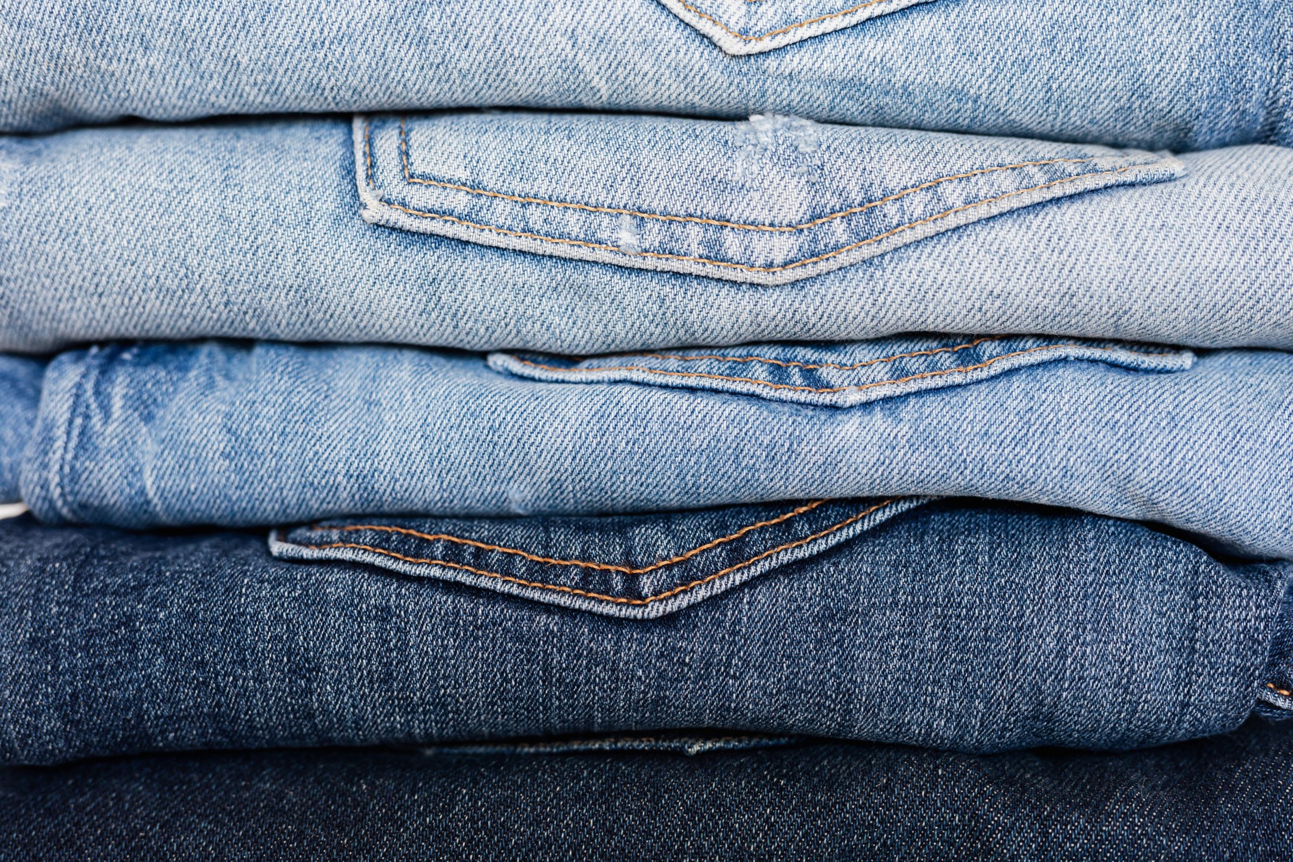 stack of folded jeans the best way to fold clothes