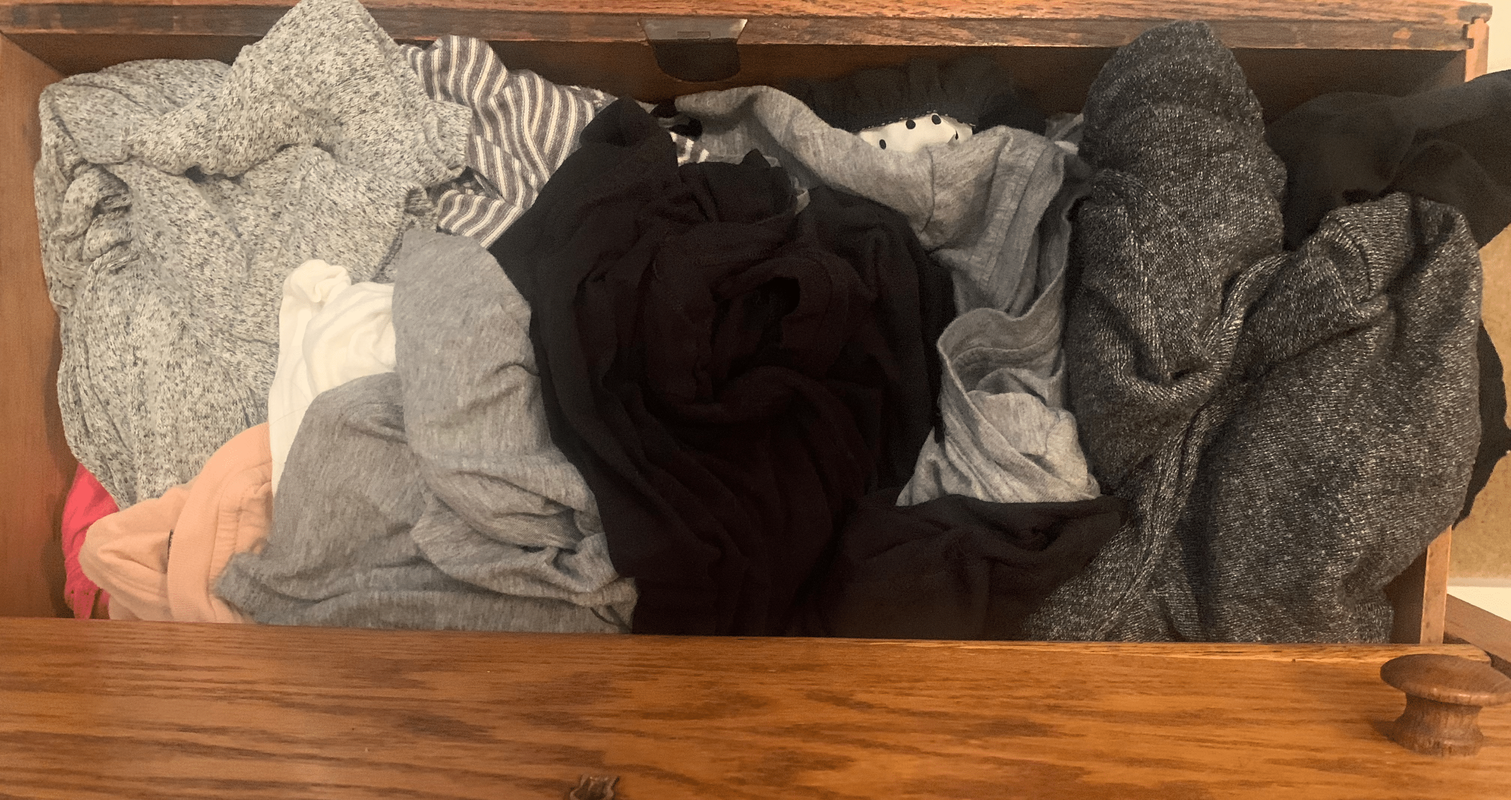 Messy drawer of clothes