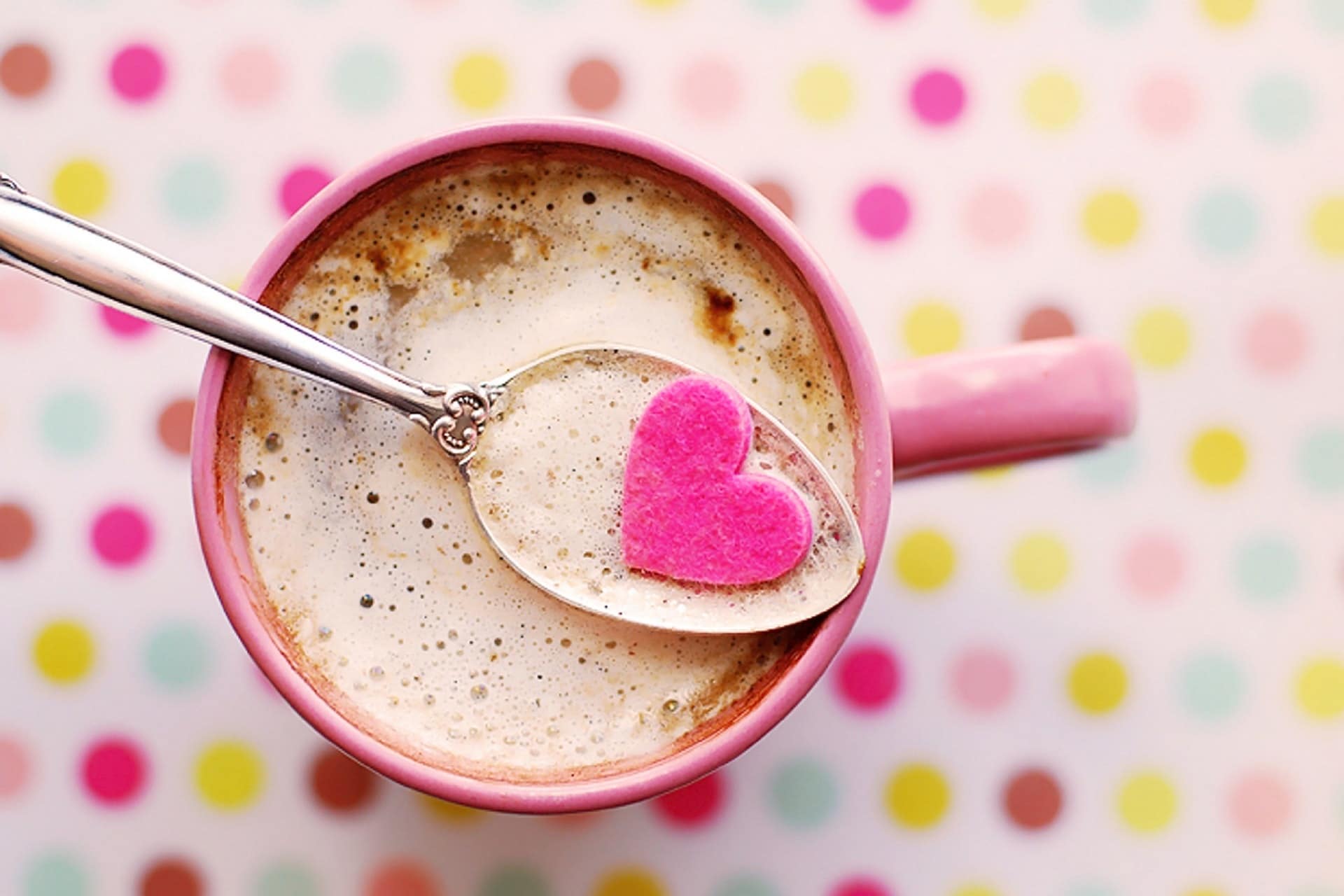 Coffee mug with a pink heart and spoon