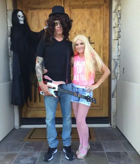 Man and woman dressed as a rock star and groupie for Halloween