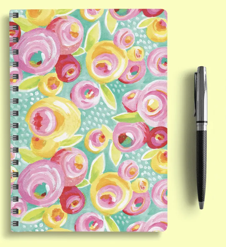 Calendar planner with flowers and a pen