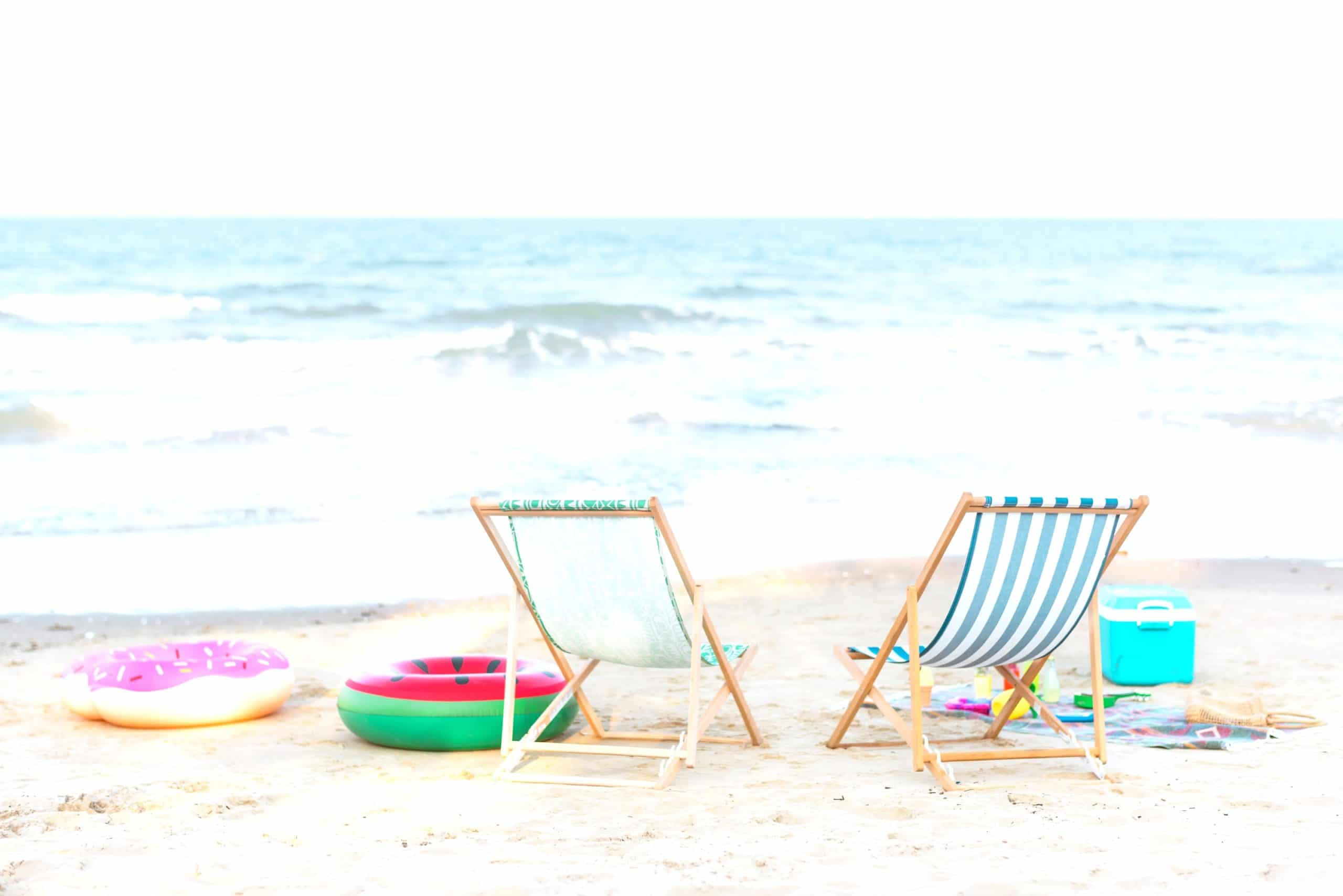 two chairs with toys at beach