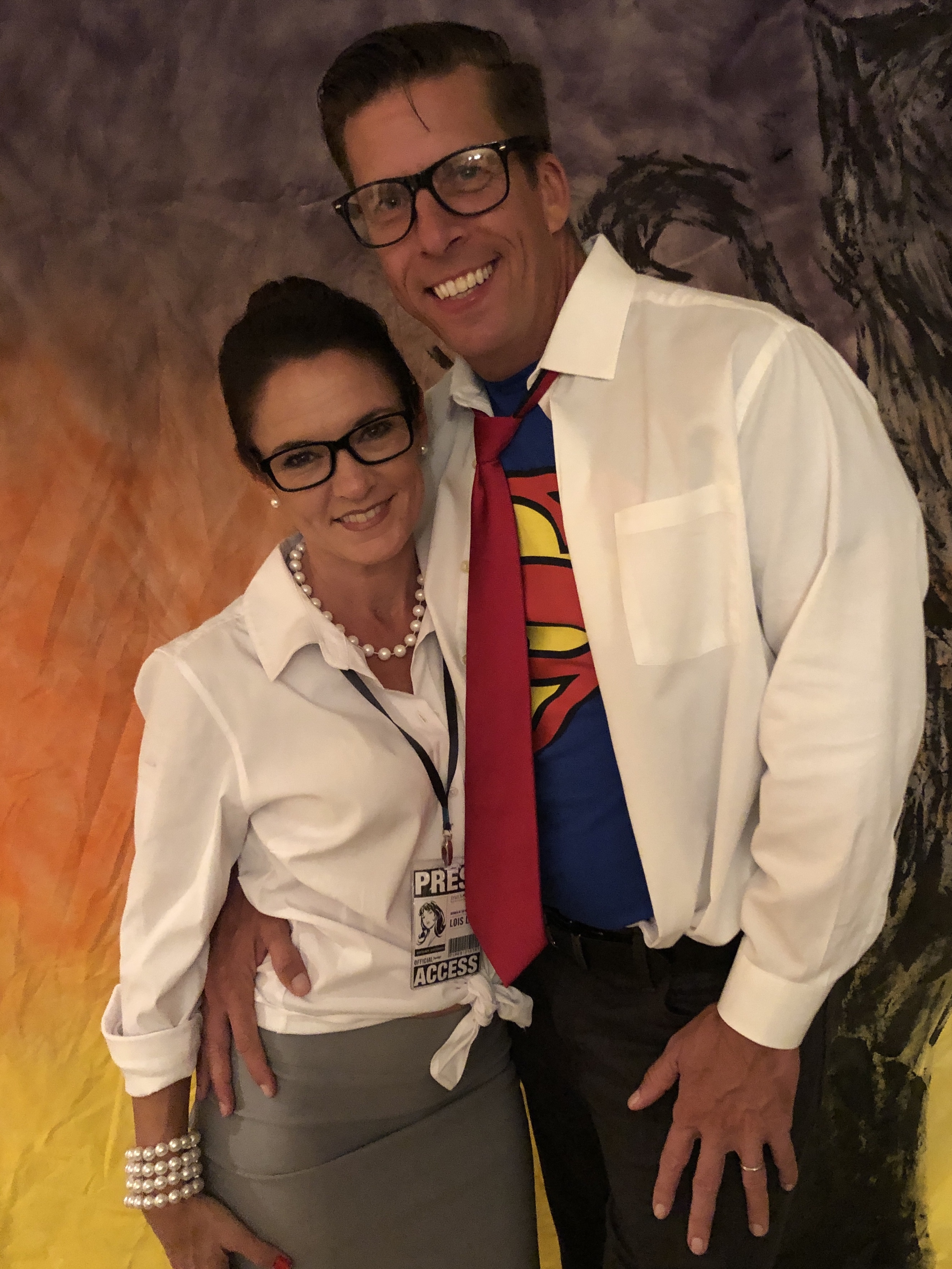 Man and woman dressed as Lois Lane and Clark Kent for Halloween 