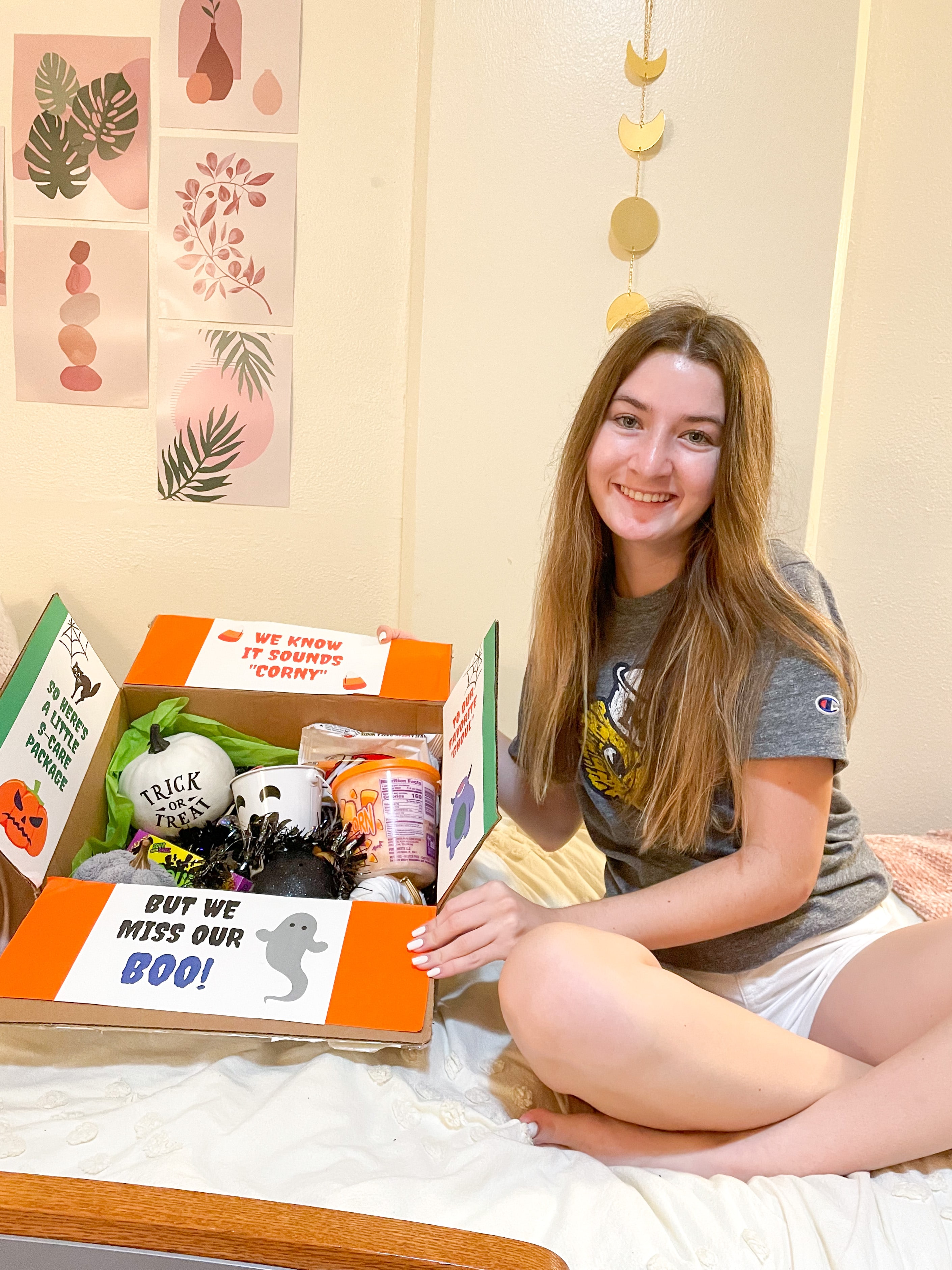 girl smiling with a Halloween care package