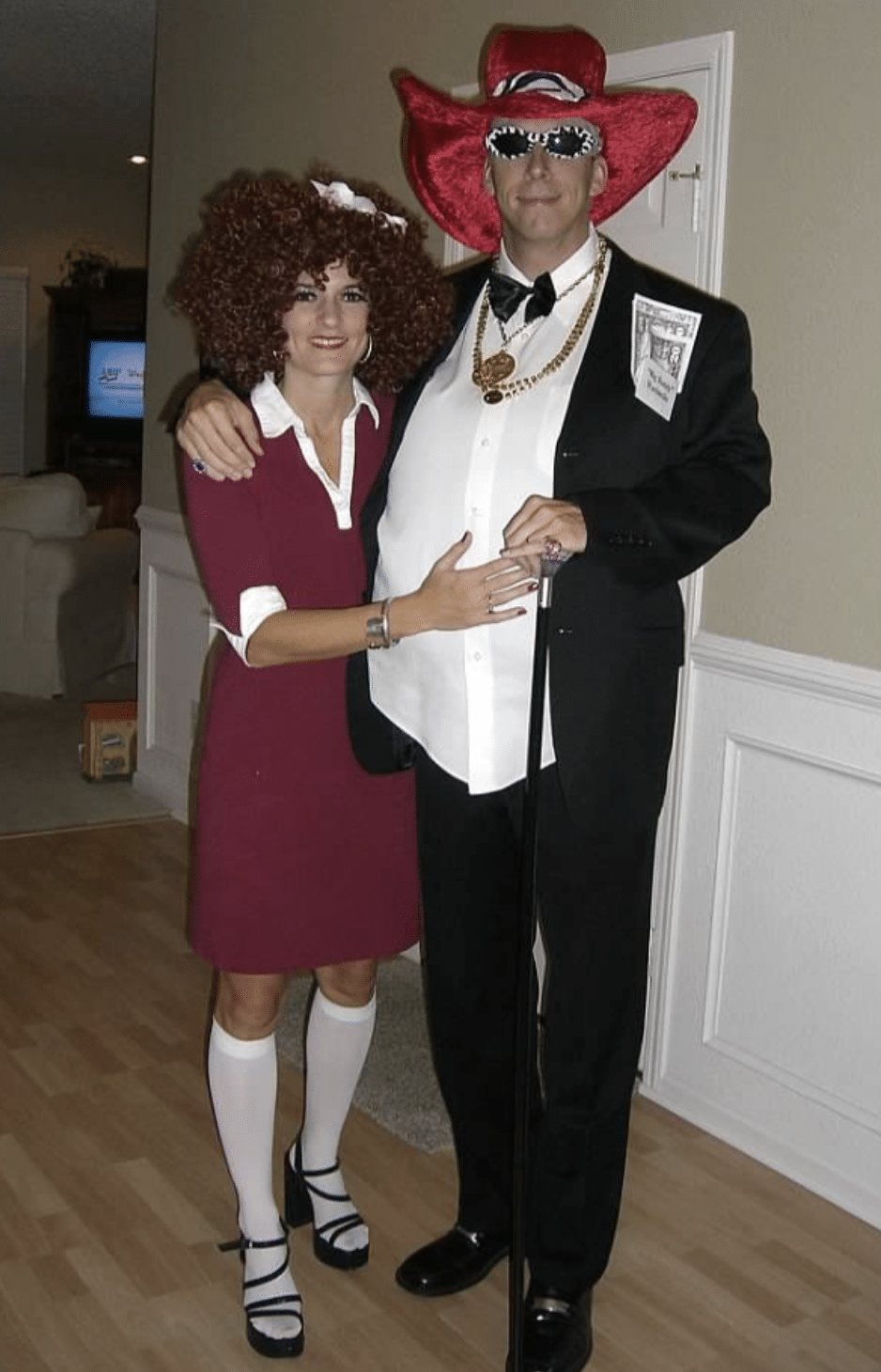 Man and woman dressed like a pimp Daddy Warbucks and a prostitute Annie