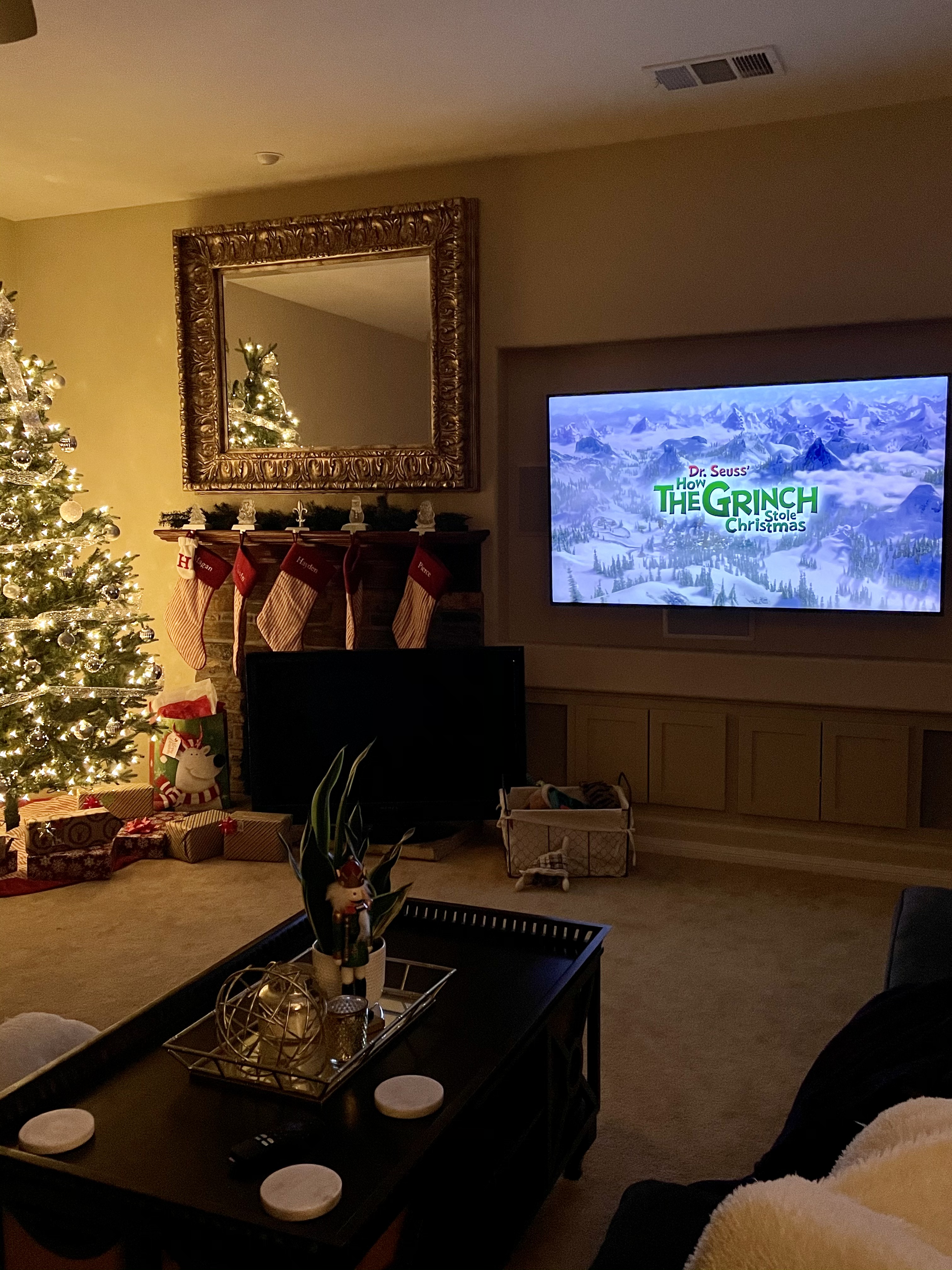 Cozy family room with The Grinch Who Stole Christmas on the TV