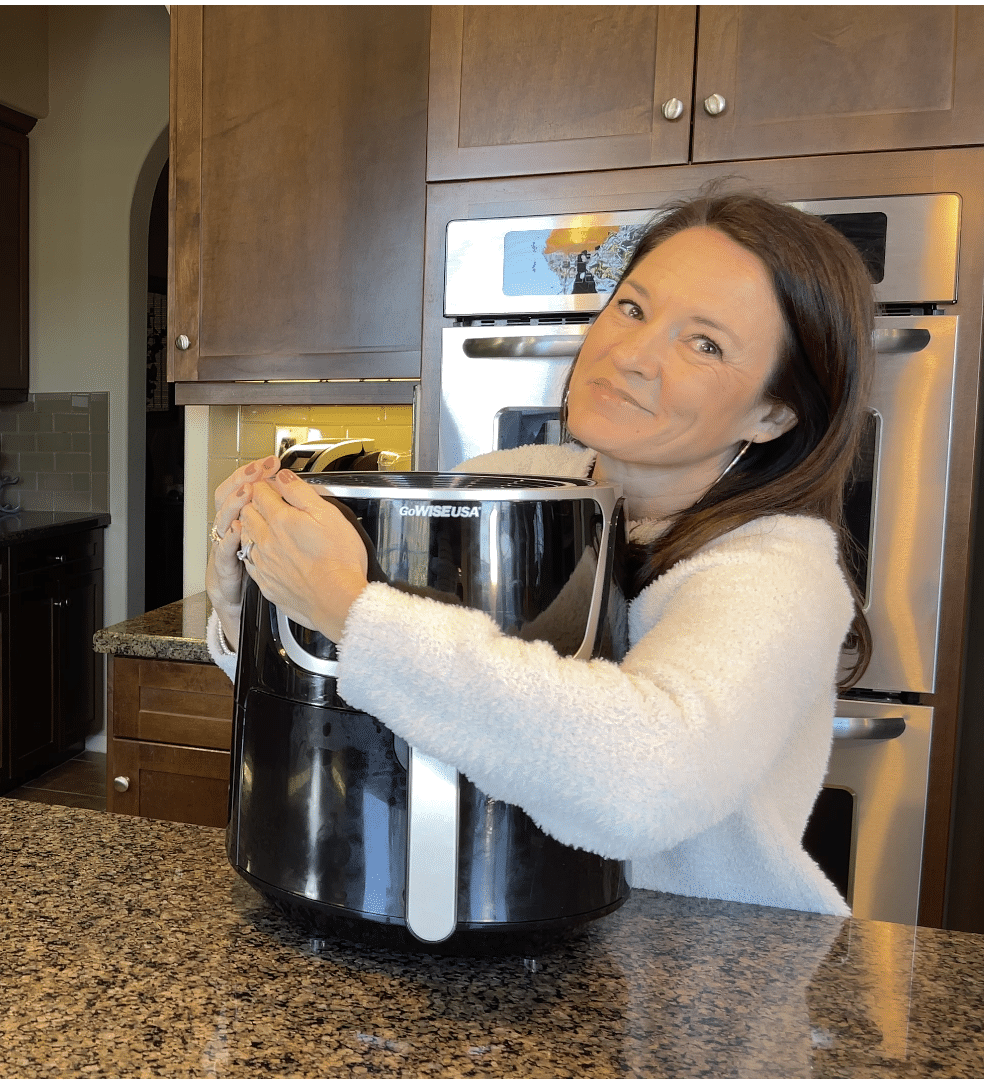 woman hugging her Go Wise Air Fryer