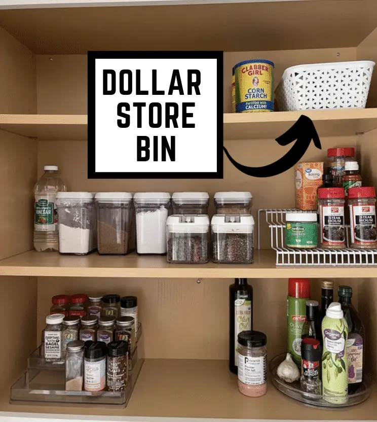 An organized Spice Cabinet with a dollar store bin inside