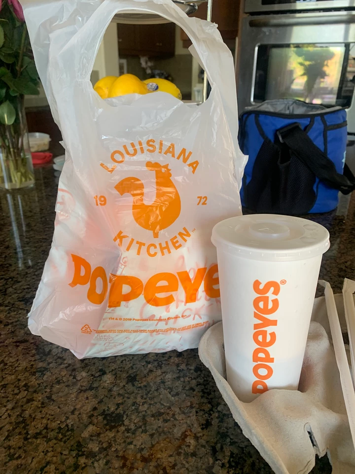 bag of Popeyes restaurant food