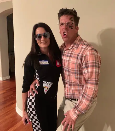 Man and woman dressed as their doppelgangers Danica Patrick and Ed Helms