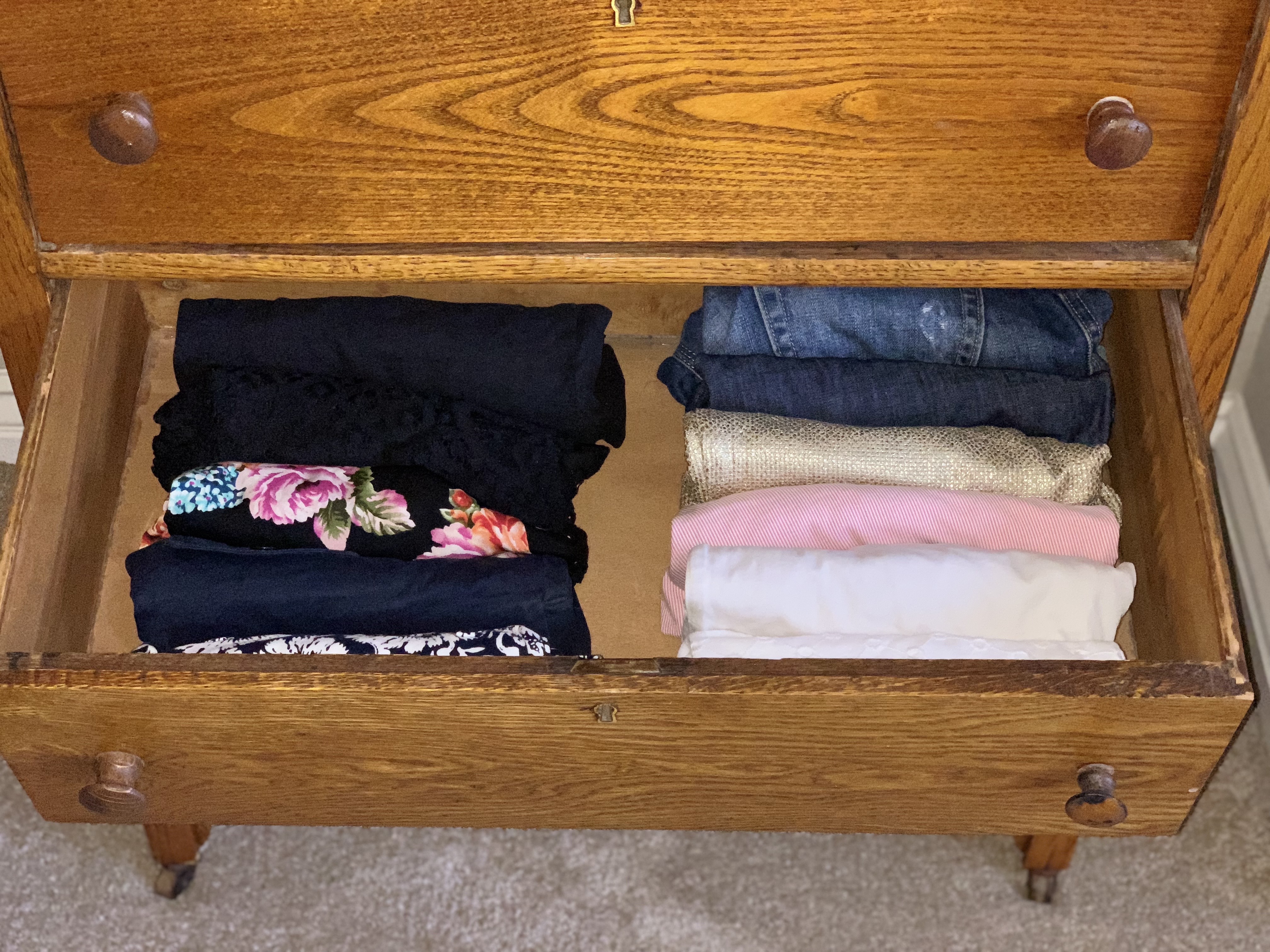 Neatly folded clothes in a drawer in the Master Bedroom