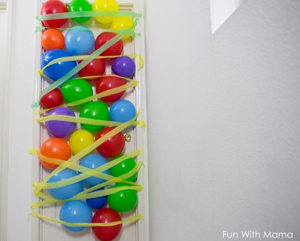 Ballons and streamers taped to a bedroom door