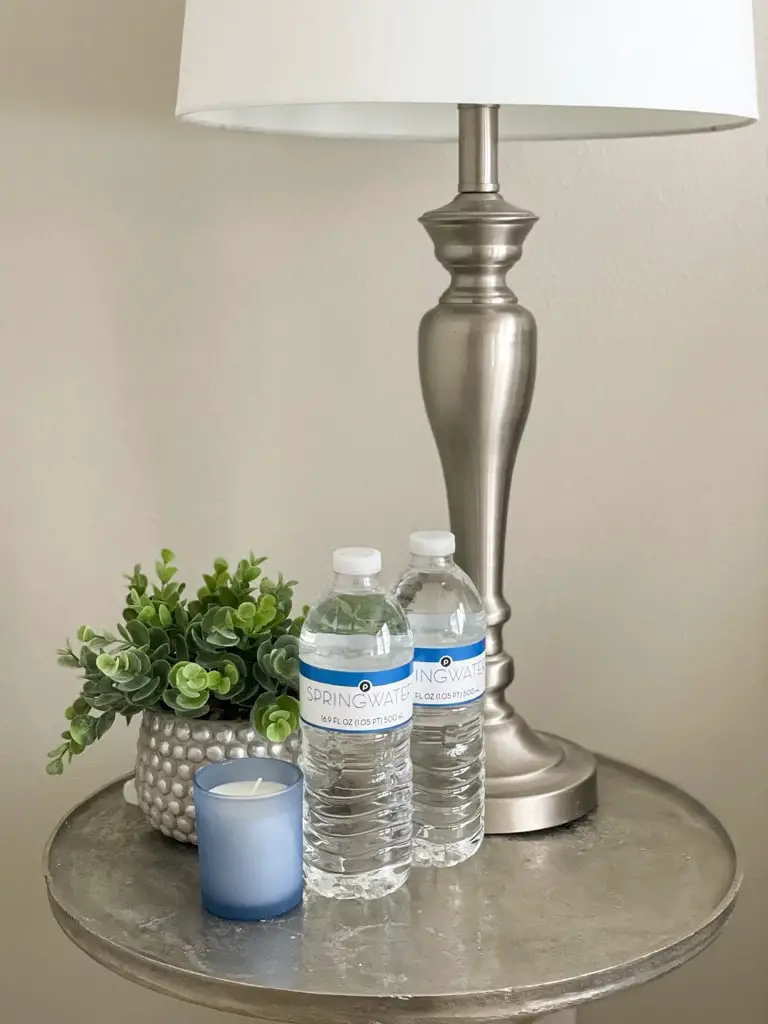 Water bottles bedside in a guest room