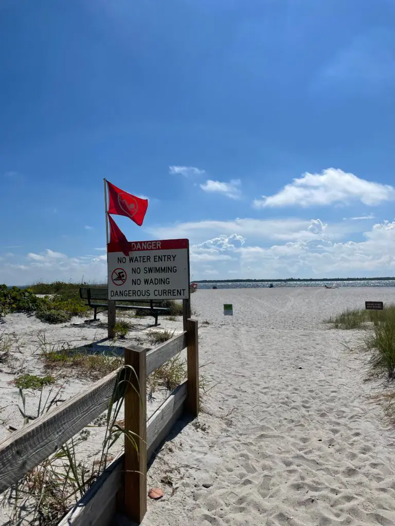 Beach warning sign of dangerous water currents