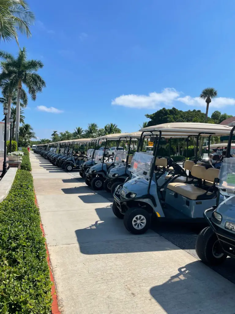 A row of golf carts parked at the Gasparilla Inn in Boca Grande