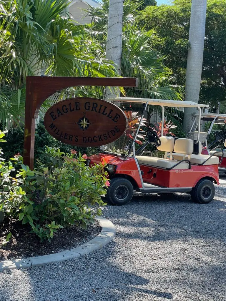 Eagle Grill sign with a golf cart on Gasparilla Island