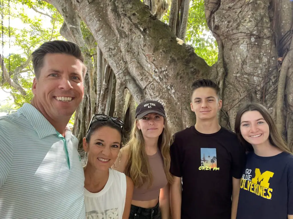 A family taking a selfie in the banyan trees of Boca Grande Florida
