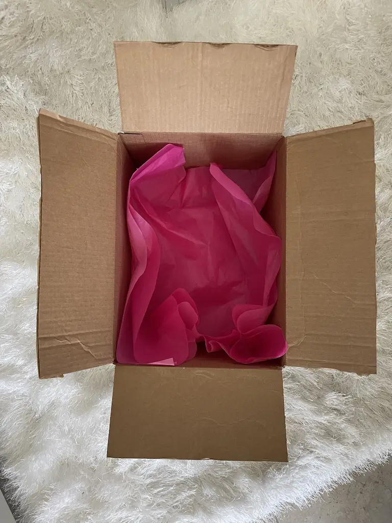Empty box with pink tissue paper